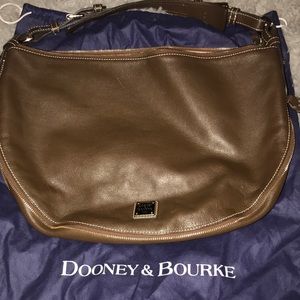 Dooney and Bourke Brown leather purse with awesome zipper design around purse